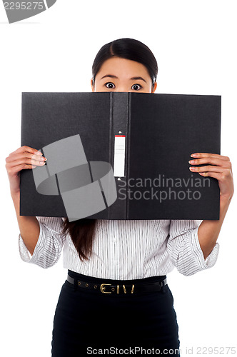 Image of Woman hiding her face with a business file