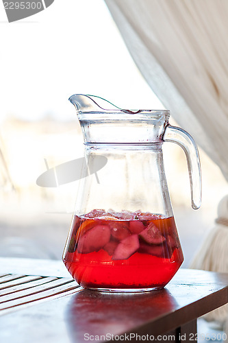Image of jug of fresh red fruit drink