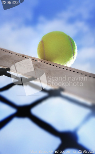 Image of Tennis ball on net´s edge