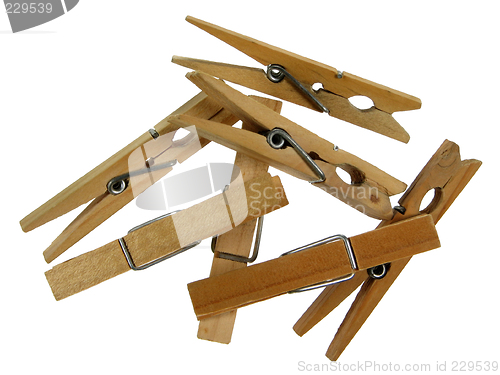 Image of Wooden clothespins on white background