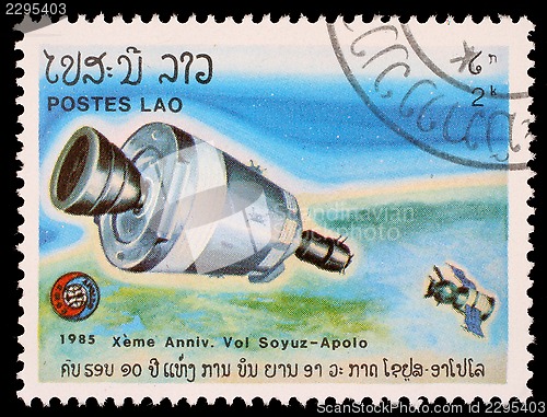 Image of Stamp printed in Laos shows experimental flight of Soyuz and Apollo