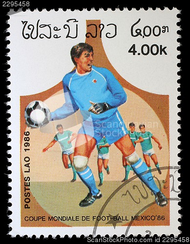 Image of Stamp printed in LAOS shows the football players