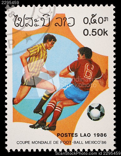 Image of Stamp printed in LAOS shows the football Players