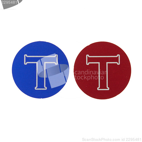 Image of Blue and red coin with the letter T 