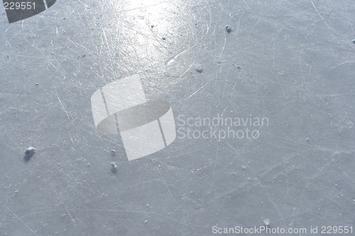 Image of Sun reflecting in the surface of an ice rink