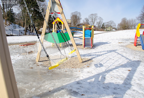 Image of view of childrens playground in winter 