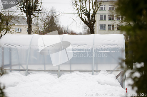 Image of polythene conservatory snow town yard season 