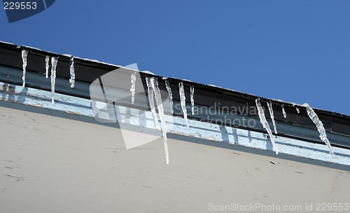 Image of Bright winter day, icicles on the roof