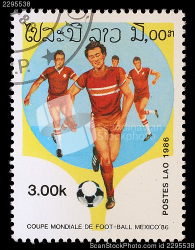 Image of Stamp printed in LAOS shows the football Players