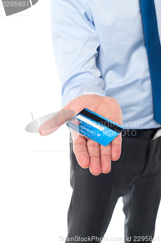 Image of Businessman displaying his cash card