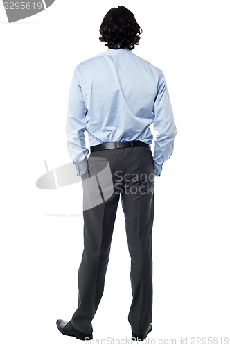 Image of Casual businessman facing the wall