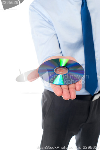 Image of Man showing compact disc, cropped image