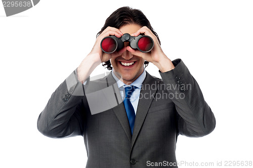 Image of Young businessman hunting success