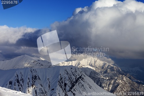 Image of Snow mountains and blue sky with clouds