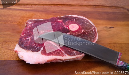 Image of Raw meat with national uzbek knife