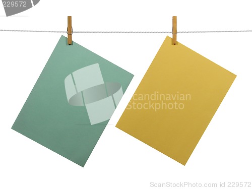 Image of Blank paper sheets on a clothes line (+clipping path)