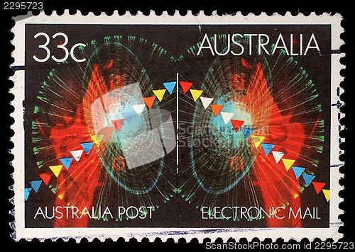 Image of Stamp printed in Australia shows symbols of electronic mail