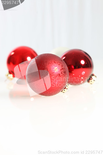 Image of Three red Christmas baubles