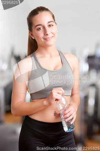 Image of Woman Holding Bottle of Water