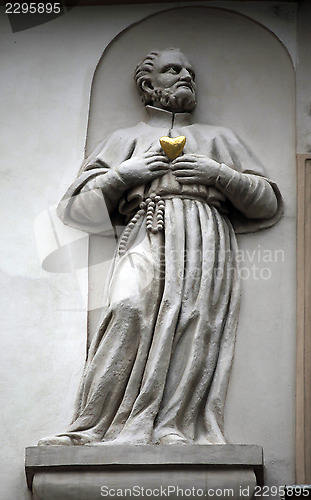 Image of Saint on facade, House of the Golden Well, Prague,