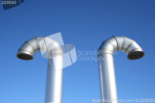 Image of Two shiny metal ventilation pipes