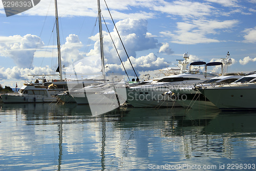 Image of Luxury yachts moored on pier