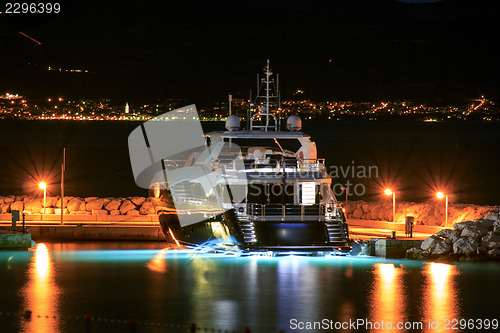 Image of Luxury yacht moored on pier night