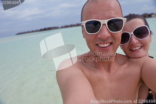 Image of happy young  couple at summer vacation have fun and relax at bea