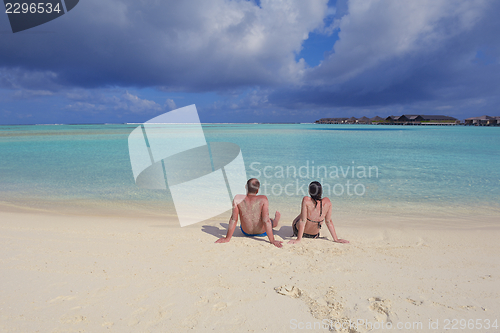 Image of happy young  couple at summer vacation have fun and relax at bea
