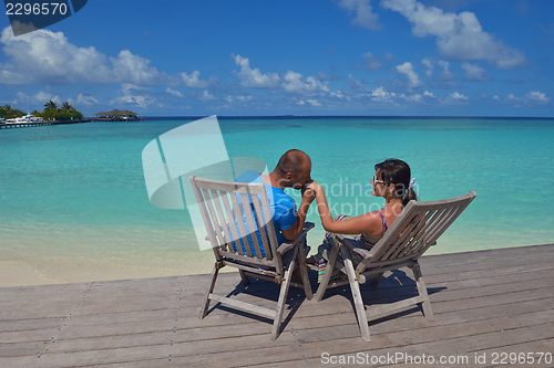 Image of happy young  couple at summer vacation have fun and relax at bea