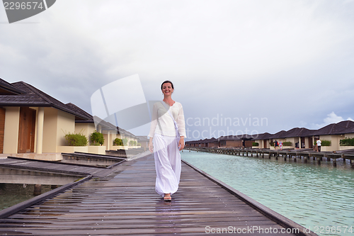 Image of young woman relax on cloudy summer day