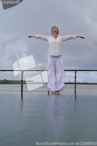 Image of young woman relax on cloudy summer day