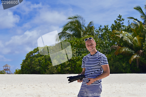 Image of photographer taking photo on beach