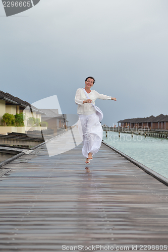 Image of young woman relax on cloudy summer day