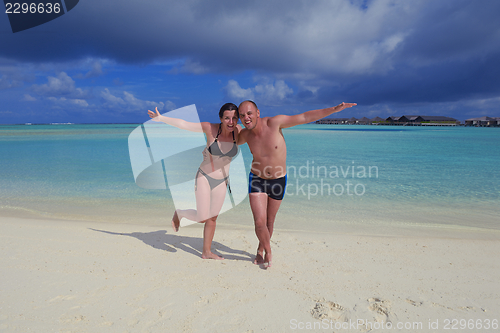 Image of happy young  couple at summer vacation have fun and relax at bea