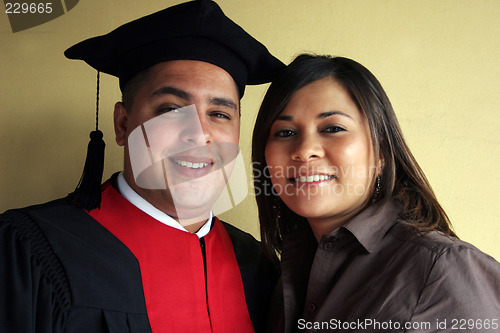 Image of University graduation celebrates his success with his girlfriend