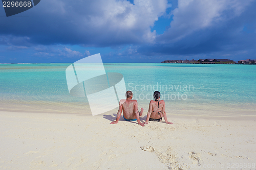 Image of happy young  couple at summer vacation have fun and relax at bea