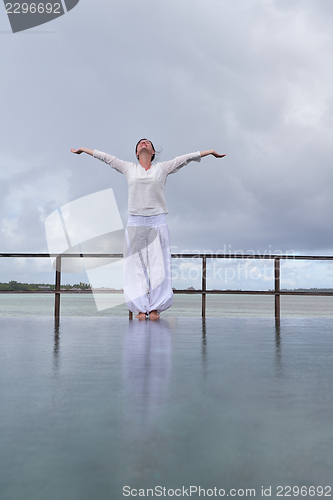 Image of young woman relax on cloudy summer day