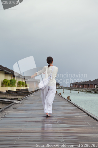 Image of young woman relax on cloudy summer day