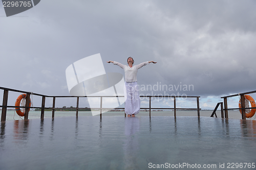 Image of young woman relax on cloudy summer day