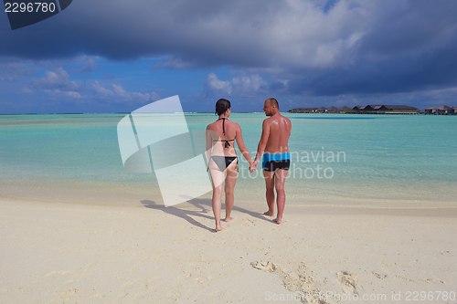 Image of happy young  couple at summer vacation have fun and relax at bea