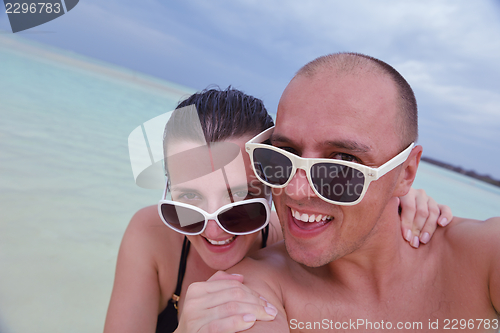 Image of happy young  couple at summer vacation have fun and relax at bea