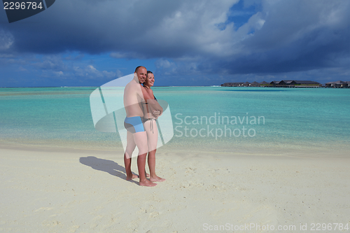 Image of happy young  couple at summer vacation have fun and relax at bea