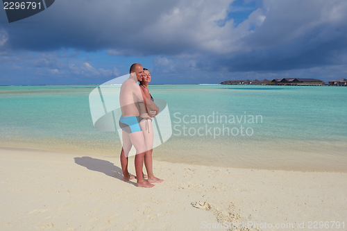 Image of happy young  couple at summer vacation have fun and relax at bea