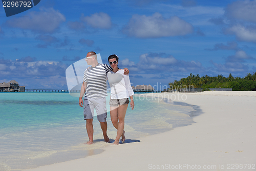Image of happy young  couple at summer vacation have fun and relax at bea
