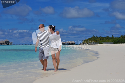 Image of happy young  couple at summer vacation have fun and relax at bea