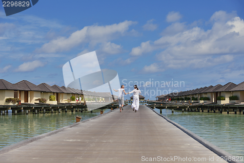 Image of happy young  couple at summer vacation have fun and relax at bea