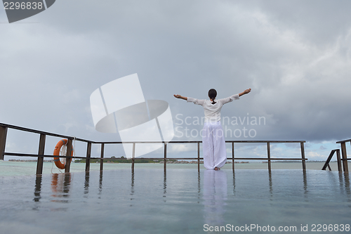 Image of young woman relax on cloudy summer day