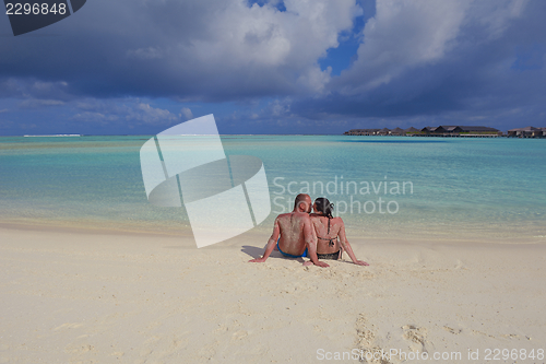 Image of happy young  couple at summer vacation have fun and relax at bea