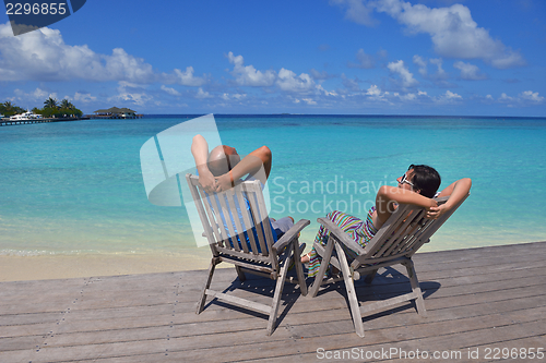 Image of happy young  couple at summer vacation have fun and relax at bea